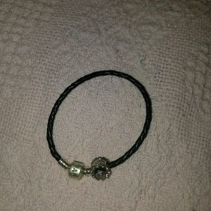 Corded leather bracelet with cake charm